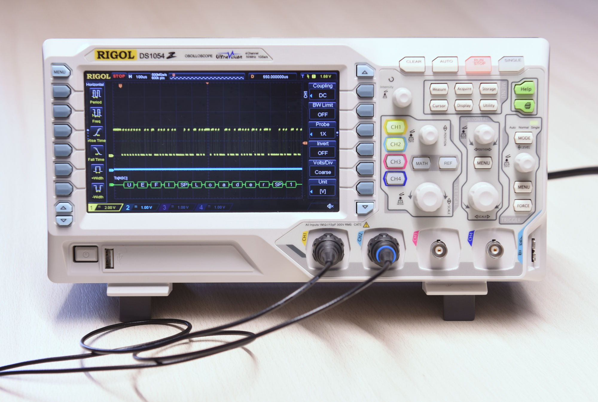 Oscilloscope Connected to Canon C5850i Mainboard Connector J32, Showing Printer Boot Messages on the Oscilloscope